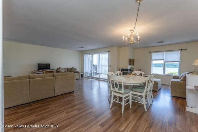 17 Riverview, Port Ewen, NY 12466 - dining area featuring healthy amount of natural light, wood finished floors, and a chandelier