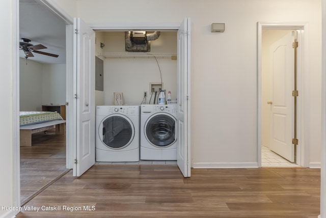 17 Riverview, Port Ewen, NY 12466 - laundry area with washer and dryer, ceiling fan, wood finished floors, and electric panel