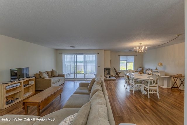 17 Riverview, Port Ewen, NY 12466 - living area featuring a chandelier, wood finished floors, and a textured ceiling
