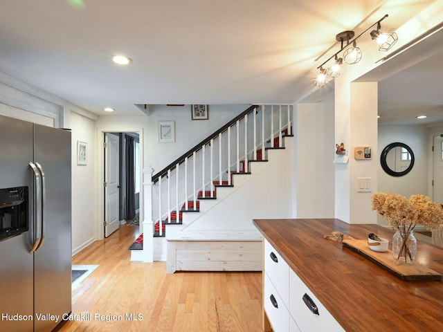 stairway featuring hardwood / wood-style flooring