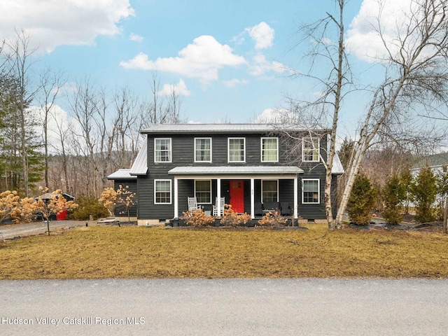 view of front of house featuring a front yard and covered porch