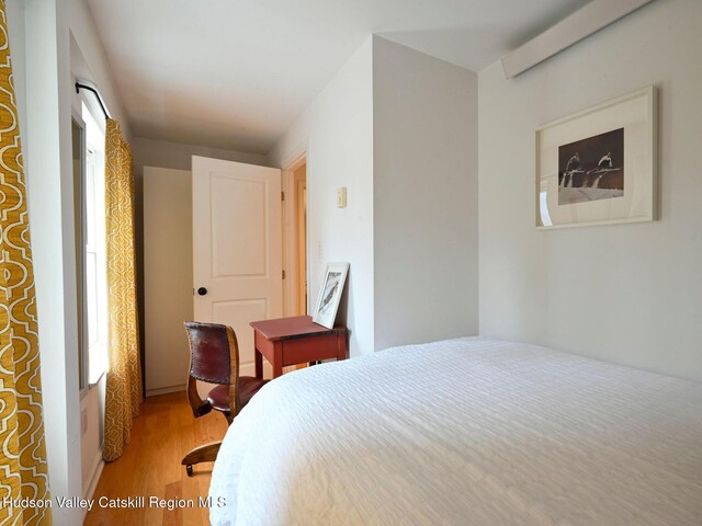 bedroom featuring hardwood / wood-style flooring