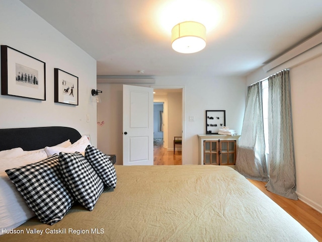 bedroom with light wood-type flooring