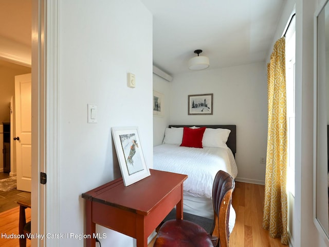 bedroom with light hardwood / wood-style flooring