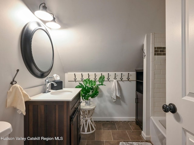 full bathroom with tile patterned flooring, vanity, toilet, and tiled shower / bath