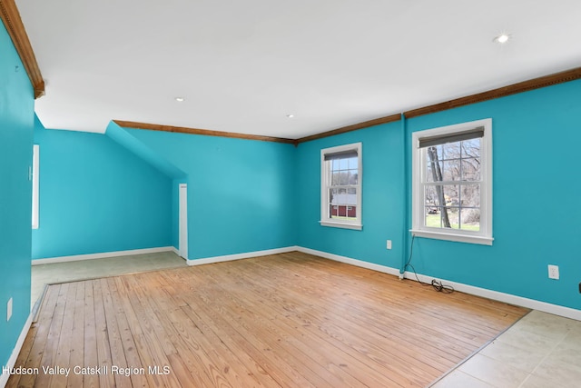 additional living space featuring baseboards, recessed lighting, and wood-type flooring