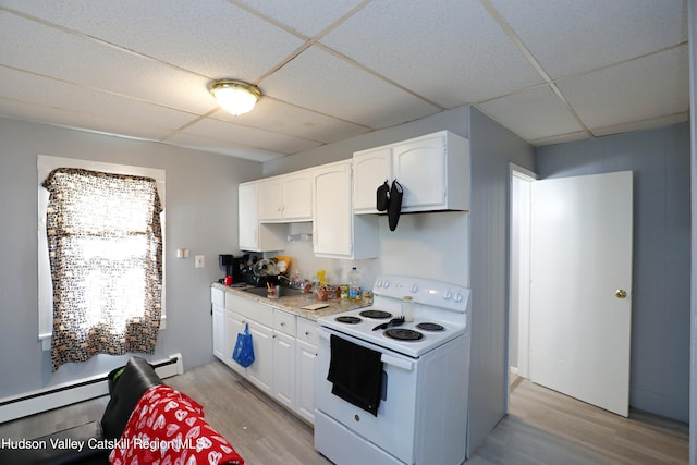 kitchen with a drop ceiling, electric range, white cabinetry, and light wood-type flooring