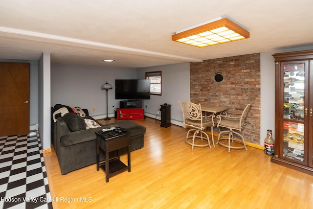 living room with hardwood / wood-style floors and a baseboard radiator