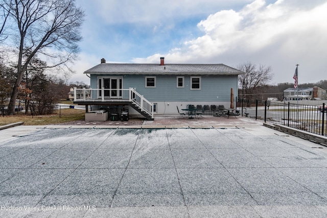 back of house with a patio and a deck