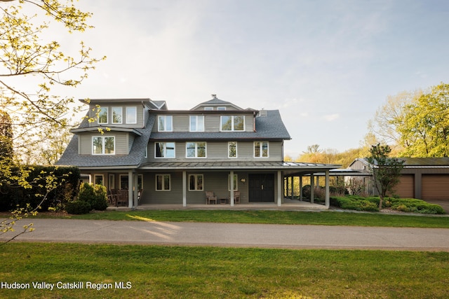 46 Pompeys Cave Rd, High Falls, NY 12440 - view of front of house featuring covered porch, a standing seam roof, a front lawn, metal roof, and a shingled roof