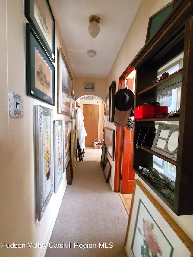 corridor featuring light carpet