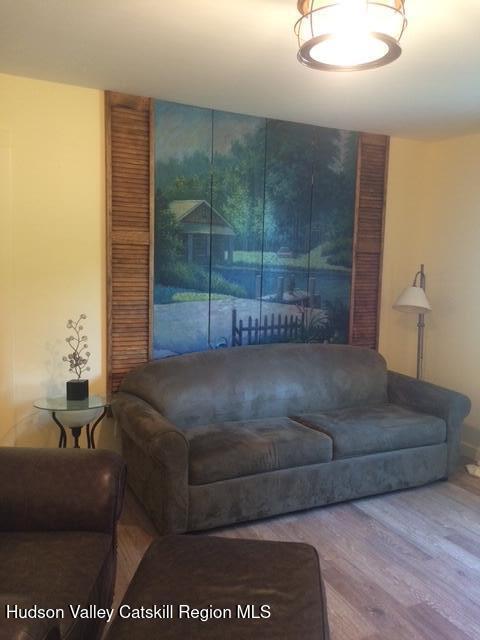 living area with wood finished floors