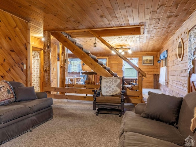 142 Pangman Rd, Gilboa, NY 12076 - living room featuring wooden walls, wood ceiling, carpet, and stairs