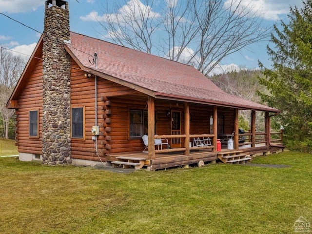 142 Pangman Rd, Gilboa, NY 12076 - back of property featuring log exterior, a chimney, and a lawn