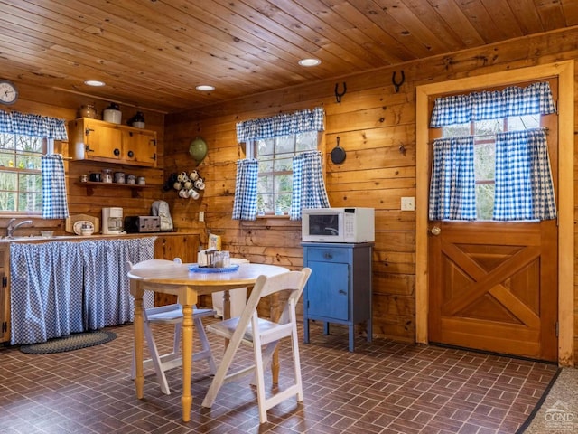 142 Pangman Rd, Gilboa, NY 12076 - dining area featuring brick patterned flooring, plenty of natural light, wooden ceiling, wooden walls, and recessed lighting