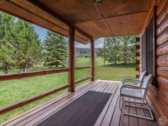 142 Pangman Rd, Gilboa, NY 12076 - wooden terrace featuring a yard