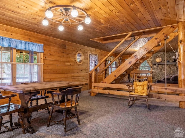 142 Pangman Rd, Gilboa, NY 12076 - carpeted dining space featuring wooden ceiling, wooden walls, and stairs