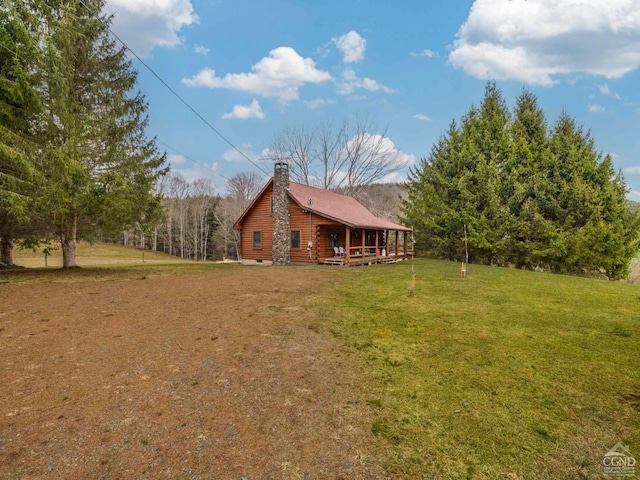 142 Pangman Rd, Gilboa, NY 12076 - back of house featuring a lawn and a chimney