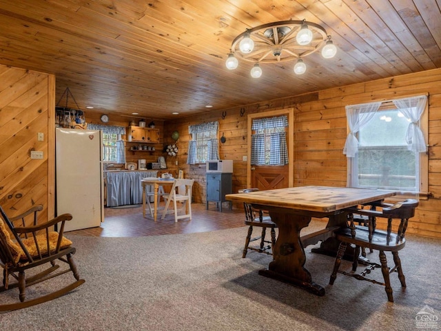 142 Pangman Rd, Gilboa, NY 12076 - dining space featuring wood ceiling, wood walls, and carpet flooring