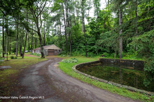 623 Rte 9j, Stuyvesant, NY 12173 - view of dirt / gravel driveway featuring a view of trees