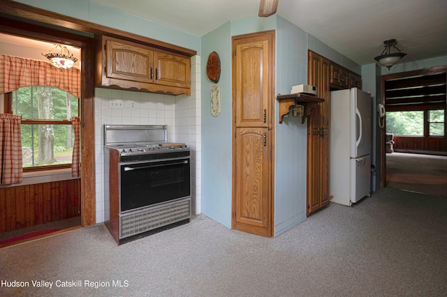 623 Rte 9j, Stuyvesant, NY 12173 - kitchen with electric range, freestanding refrigerator, light colored carpet, and brown cabinets