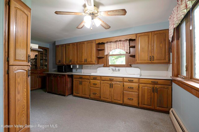623 Rte 9j, Stuyvesant, NY 12173 - kitchen featuring baseboard heating, open shelves, black microwave, and brown cabinetry