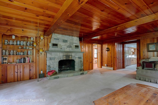 623 Rte 9j, Stuyvesant, NY 12173 - unfurnished living room featuring a baseboard heating unit, a wood ceiling with exposed beams, wood walls, carpet flooring, and a fireplace