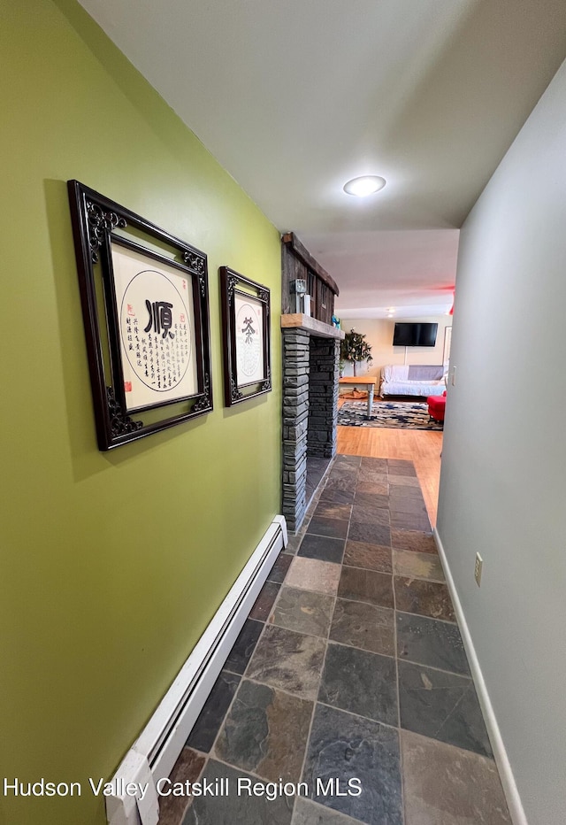 hall featuring dark hardwood / wood-style flooring and a baseboard radiator