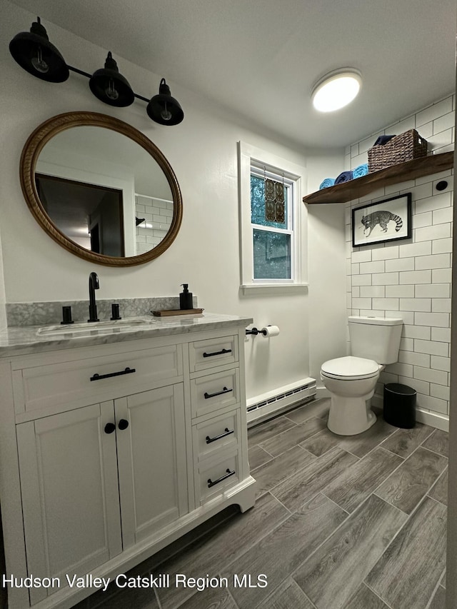 20 Kelder Rd, Olivebridge, NY 12461 - bathroom featuring vanity, a baseboard radiator, and wood finished floors