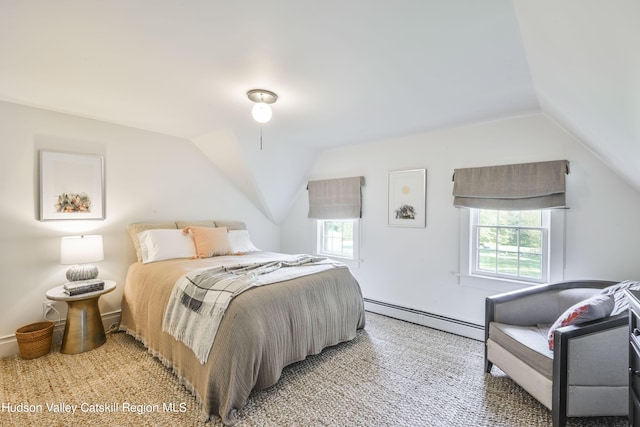 bedroom with carpet flooring, lofted ceiling, and a baseboard heating unit