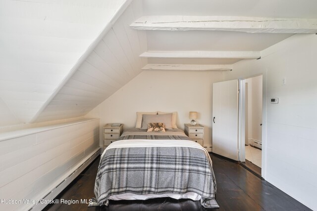 bedroom featuring lofted ceiling, dark wood-type flooring, and baseboard heating