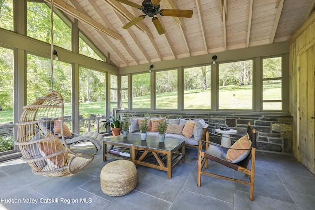 sunroom with wood ceiling, a wealth of natural light, ceiling fan, and lofted ceiling with beams