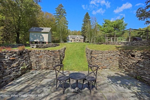 view of patio featuring a shed