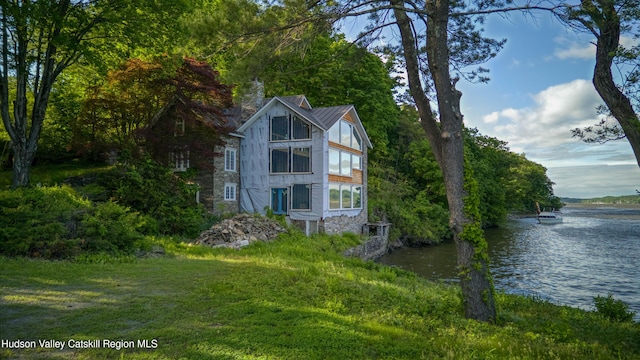 70 Floyd Ackert Rd, West Park, NY 12493 - view of side of home featuring a water view, a chimney, and metal roof