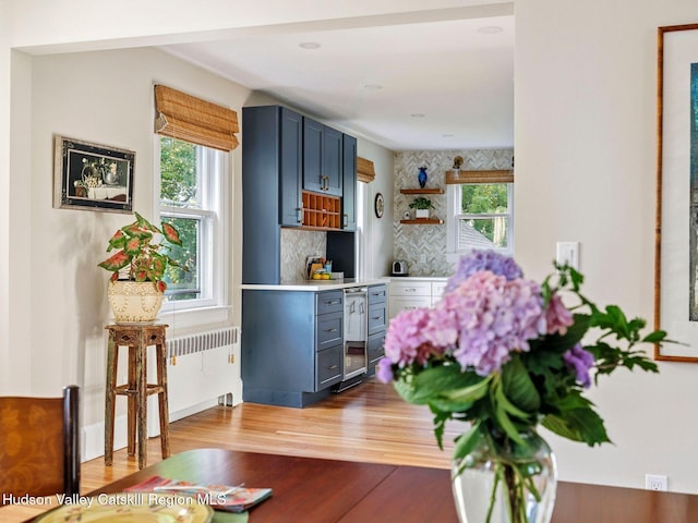90 Emerson St, Kingston, NY 12401 - bar area featuring wood finished floors, backsplash, radiator, and wine cooler