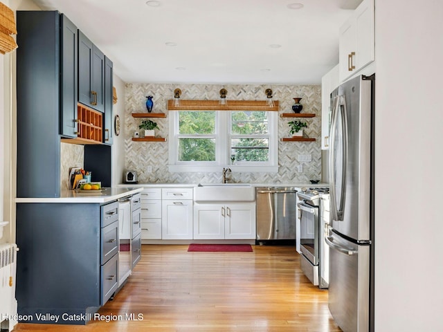 90 Emerson St, Kingston, NY 12401 - kitchen with open shelves, appliances with stainless steel finishes, and decorative backsplash