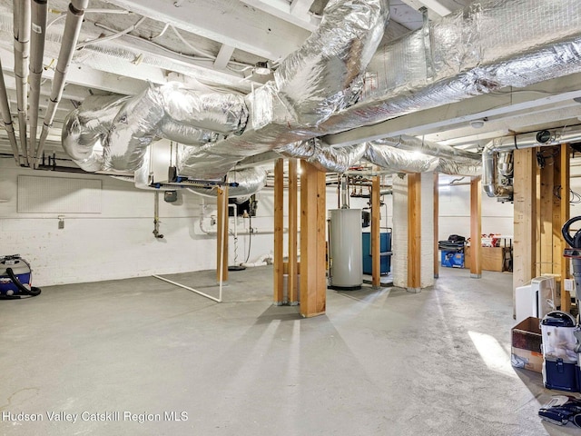 90 Emerson St, Kingston, NY 12401 - unfinished basement featuring water heater, a heating unit, and drainage system