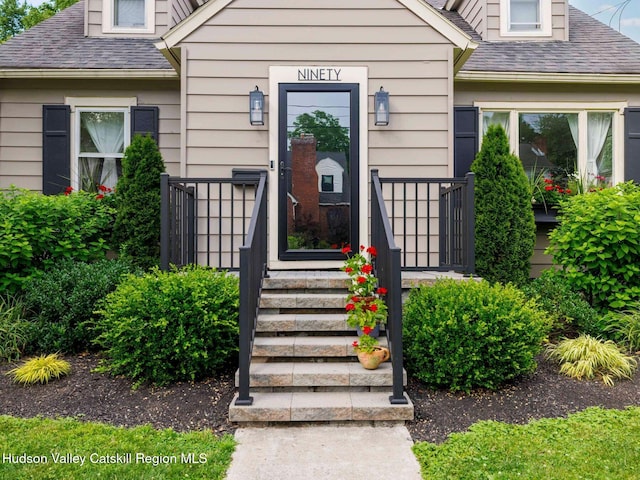 90 Emerson St, Kingston, NY 12401 - view of exterior entry featuring roof with shingles