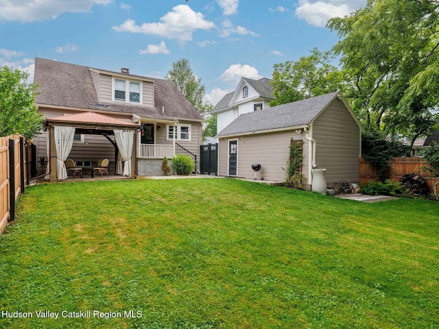 90 Emerson St, Kingston, NY 12401 - rear view of property featuring a gazebo, a fenced backyard, a patio, and an outbuilding