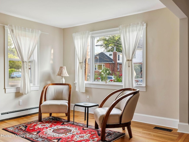 90 Emerson St, Kingston, NY 12401 - sitting room featuring wood finished floors and a baseboard radiator