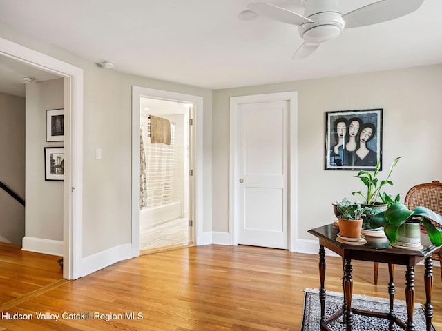 90 Emerson St, Kingston, NY 12401 - living area featuring light wood finished floors, ceiling fan, and an upstairs landing