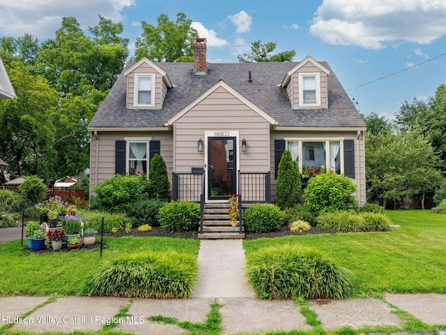90 Emerson St, Kingston, NY 12401 - cape cod home featuring a front lawn, a chimney, and a shingled roof