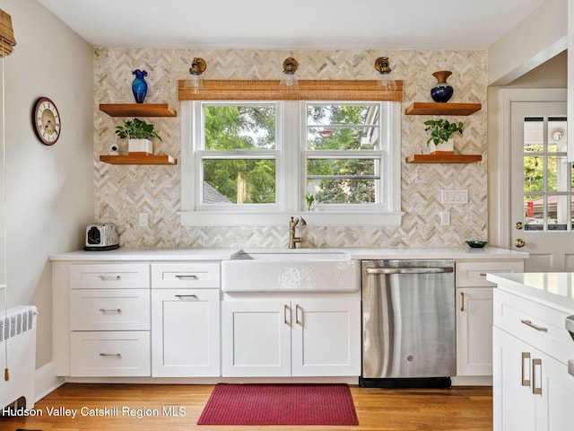90 Emerson St, Kingston, NY 12401 - kitchen with open shelves, stainless steel dishwasher, radiator, and light countertops