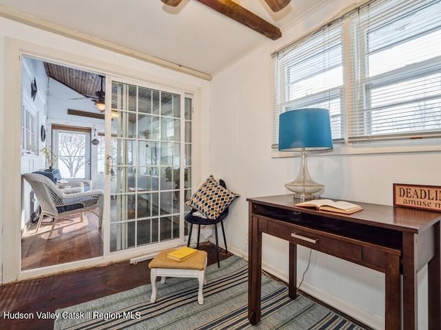 sitting room featuring ceiling fan and lofted ceiling with beams