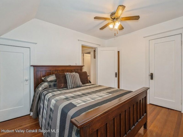 bedroom with ceiling fan and wood-type flooring