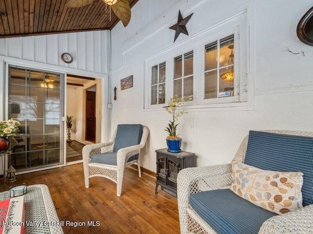 sunroom featuring wooden ceiling and ceiling fan