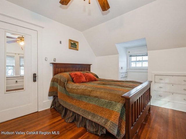 bedroom featuring ceiling fan, lofted ceiling, and hardwood / wood-style flooring