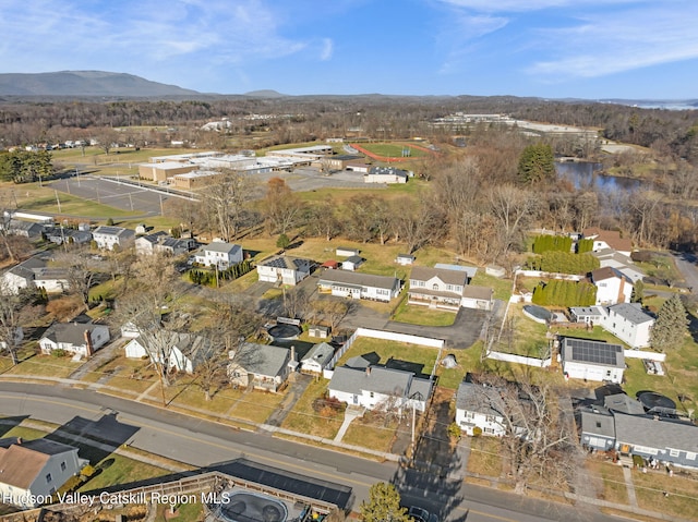 bird's eye view with a water and mountain view