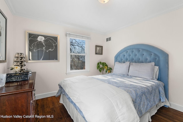 bedroom featuring dark hardwood / wood-style floors and ornamental molding