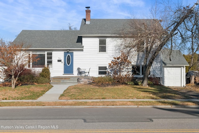 split level home with a garage and a front yard